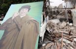 123 Mouammar Kadhafi fait le gros dos et contre-attaque